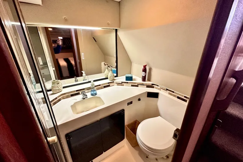 Slide: The Image of Bathroom interior of 1993 Bayliner 4588 Pilothouse yacht, featuring modern fixtures and decor. - 21