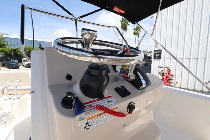 Slide: The Image of Helm of a Boston Whaler 210 Montauk with steering wheel and instruments. - 17