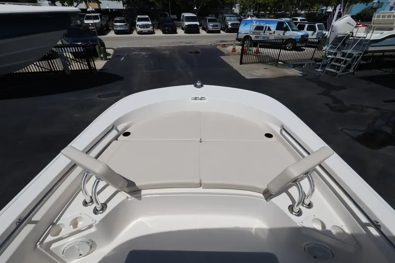 Slide: The Image of The 2027 Boston Whaler 210 Montauk features a spacious bow area with cushioned seating. - 20