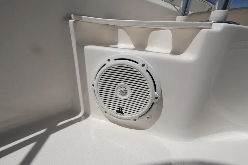 Slide: The Image of A speaker is integrated into the white interior paneling of a boat. - 24