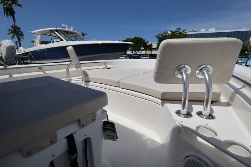 Slide: The Image of The image shows the deck of a Boston Whaler 210 Montauk with seating and a clear sky. - 21