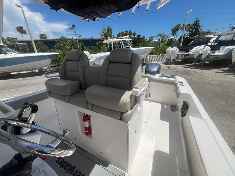 Slide: The Image of The image shows the cockpit of a 2019 Everglades 295 Center Console boat. - 20