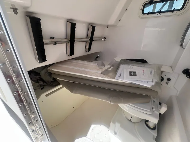 Slide: The Image of Interior of an Everglades 295 Center Console boat with seating and storage area. - 30