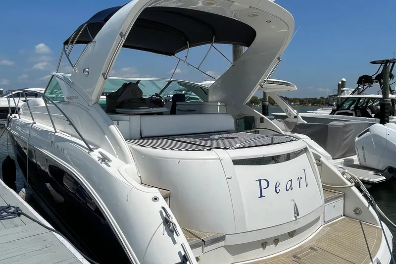 Slide: The Image of 2004 Fairline Targa 40 yacht named "Pearl" docked at a marina. - 0