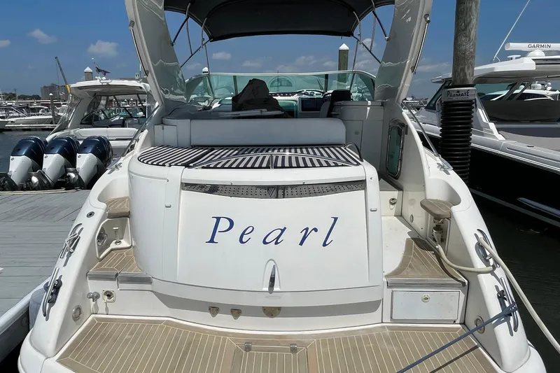 Slide: The Image of 2004 Fairline Targa 40 yacht named "Pearl" docked at a marina. - 1