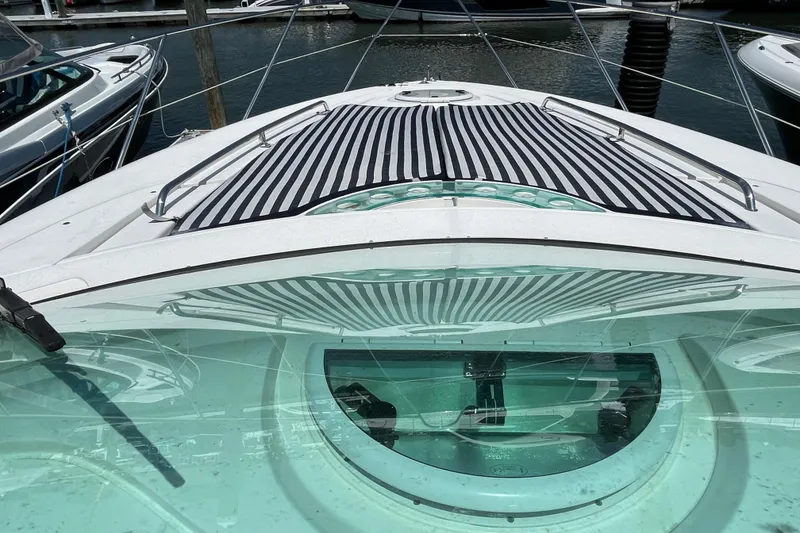 Slide: The Image of 2004 Fairline Targa 40 yacht with striped sunbed, docked at marina. - 3