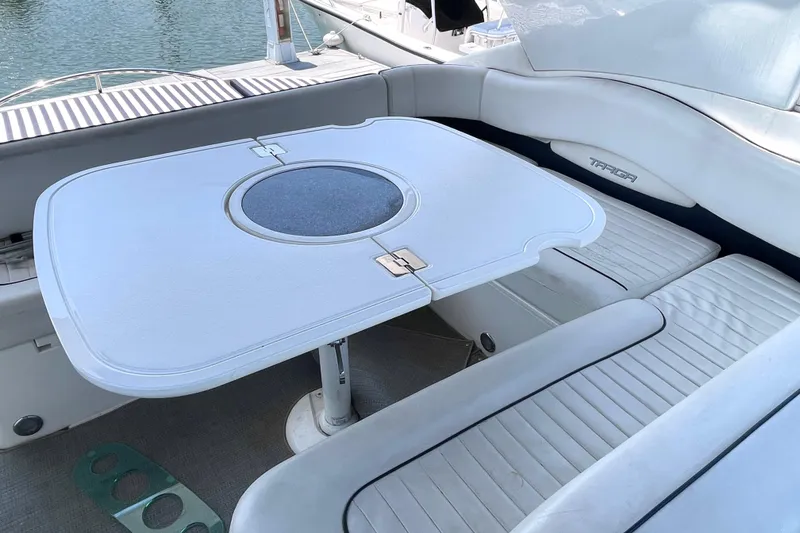 Slide: The Image of Luxury seating area on a 2004 Fairline Targa 40 yacht with a stylish table. - 6