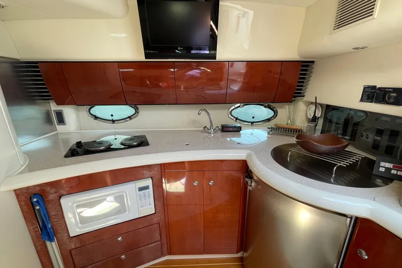 Slide: The Image of 2004 Fairline Targa 40 yacht kitchen with modern appliances and sleek cabinetry. - 8