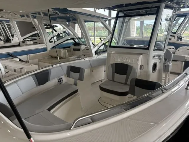 Slide: The Image of 2026 Robalo R250 Center Console in showroom. - 3