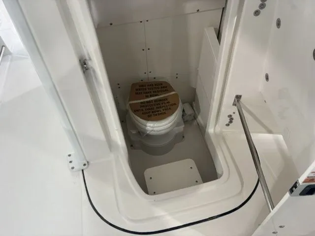 Slide: The Image of Interior of 2026 Robalo R250 with toilet. - 7