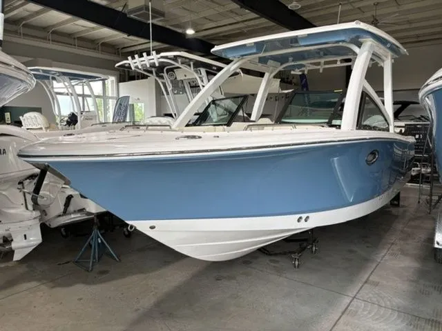The Image of 2026 Robalo R257 Dual Console boat in showroom. - 1