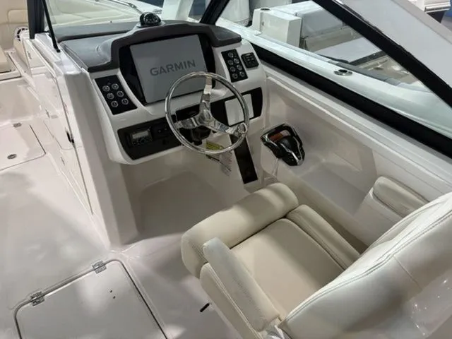 Slide: The Image of Interior of 2026 Robalo R257 Dual Console with Garmin controls. - 5