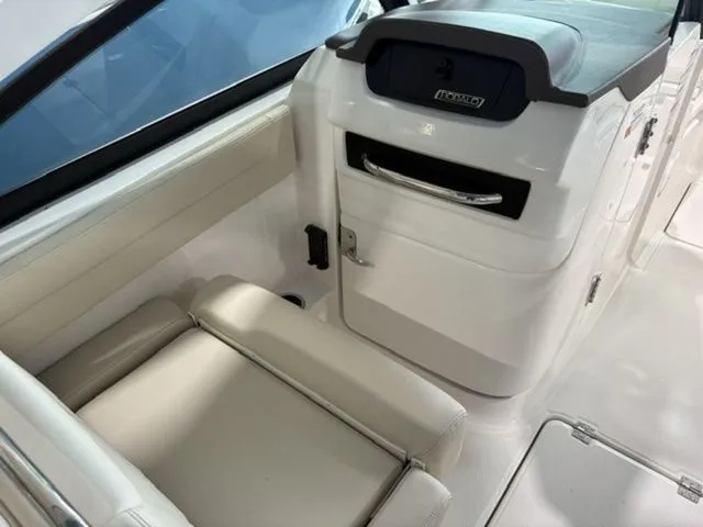 Slide: The Image of Interior of 2026 Robalo R257 Dual Console with beige seating. - 6