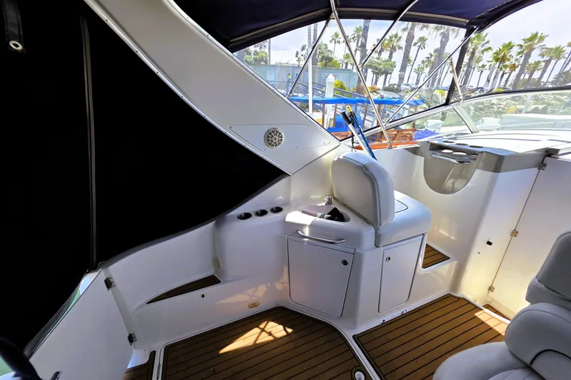 Slide: The Image of Interior of a 1999 Bayliner 3055 Ciera boat with seating and wood flooring. - 4