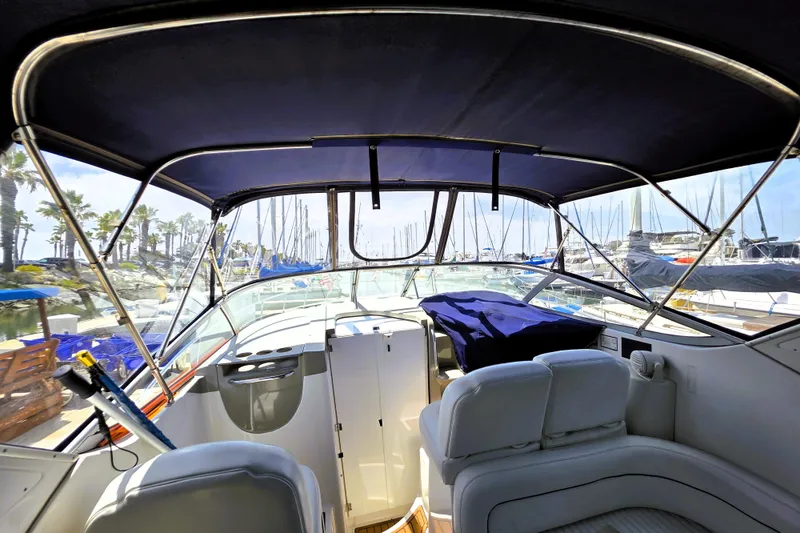 Slide: The Image of Interior view of a 1999 Bayliner 3055 Ciera boat docked at a marina. - 6