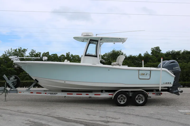The Image of 2023 Sea Hunt Gamefish 25 boat on trailer, side view, outdoors. - 0