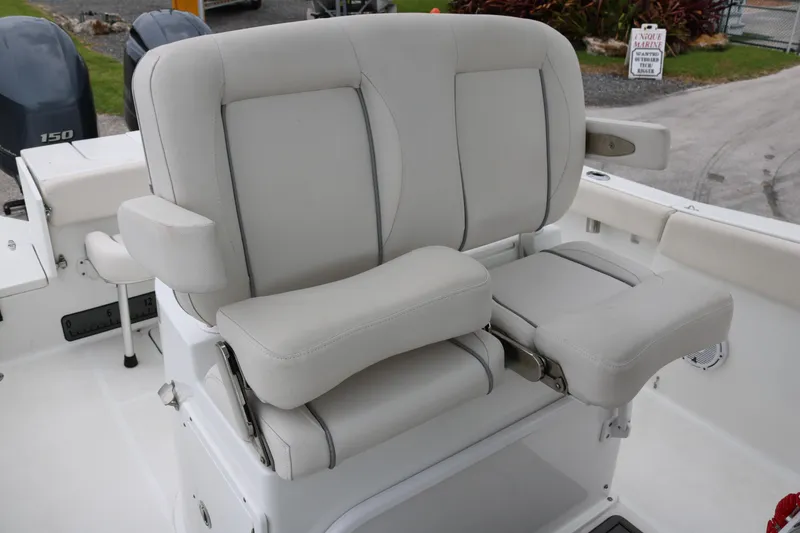 Slide: The Image of 2023 Sea Hunt Gamefish 25 boat seat with cushioned armrests and adjustable backrest. - 13