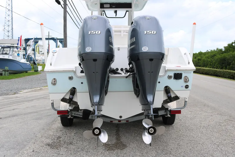 Slide: The Image of 2023 Sea Hunt Gamefish 25 boat with dual Yamaha 150 engines, rear view. - 4