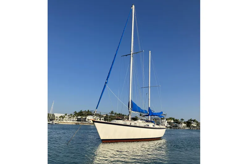The Image of 1981 Pearson 365 Ketch sailing on calm waters. - 0