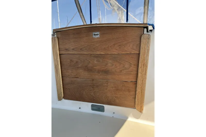 Slide: The Image of Wooden hatch door on a 1981 Pearson 365 Ketch sailboat, showcasing classic nautical design. - 11