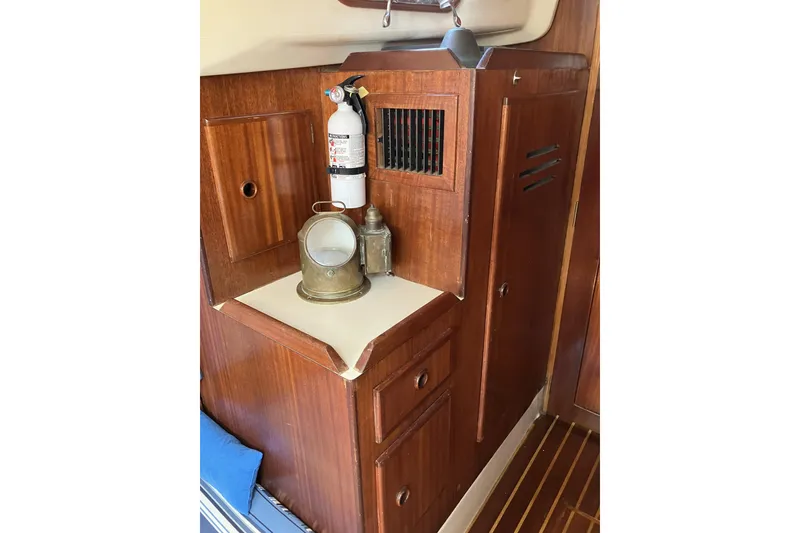 Slide: The Image of Interior of 1981 Pearson 365 Ketch with wooden cabinetry and nautical decor. - 18