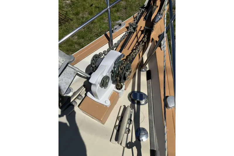 Slide: The Image of Deck of 1981 Pearson 365 Ketch with anchor chain and winch system. - 2