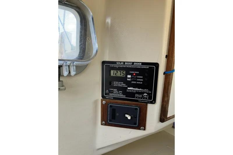 Slide: The Image of Solar charge controller on 1981 Pearson 365 Ketch displaying voltage reading. - 24