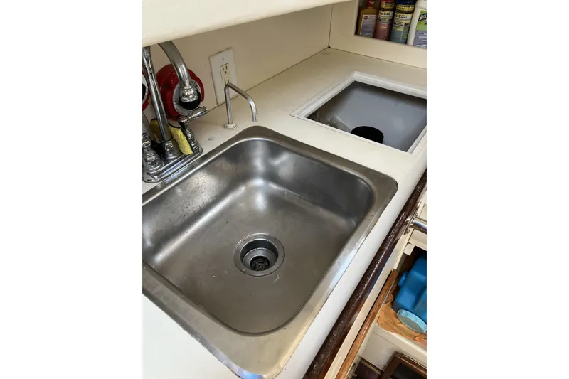 Slide: The Image of Stainless steel sink in 1981 Pearson 365 Ketch yacht kitchen area. - 27