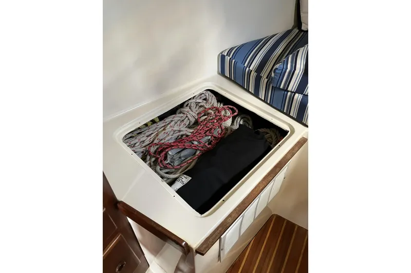 Slide: The Image of Storage compartment with ropes on a 1981 Pearson 365 Ketch sailboat. - 29