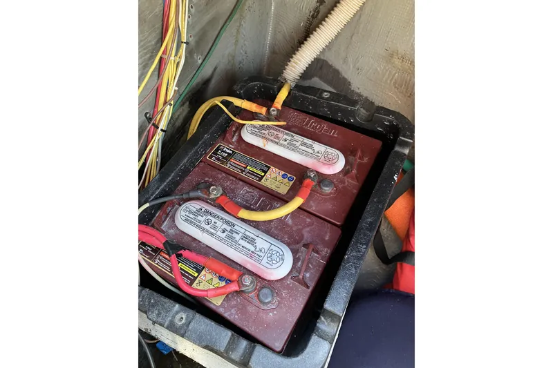Slide: The Image of Battery compartment of a 1981 Pearson 365 Ketch sailboat with wiring connections. - 39