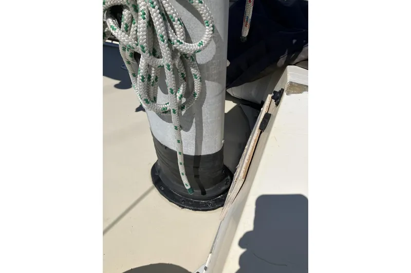 Slide: The Image of Deck of 1981 Pearson 365 Ketch sailboat with coiled ropes and mast base. - 4