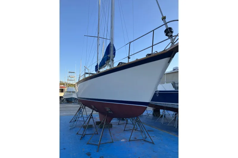 Slide: The Image of 1981 Pearson 365 Ketch sailboat on stands, ready for maintenance in a boatyard. - 43