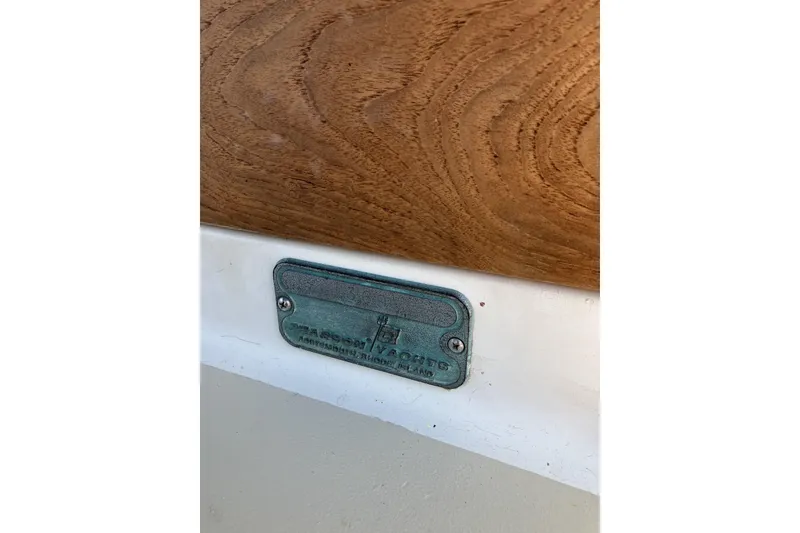 Slide: The Image of Plaque on 1981 Pearson 365 Ketch yacht, featuring wood and metal details. - 46