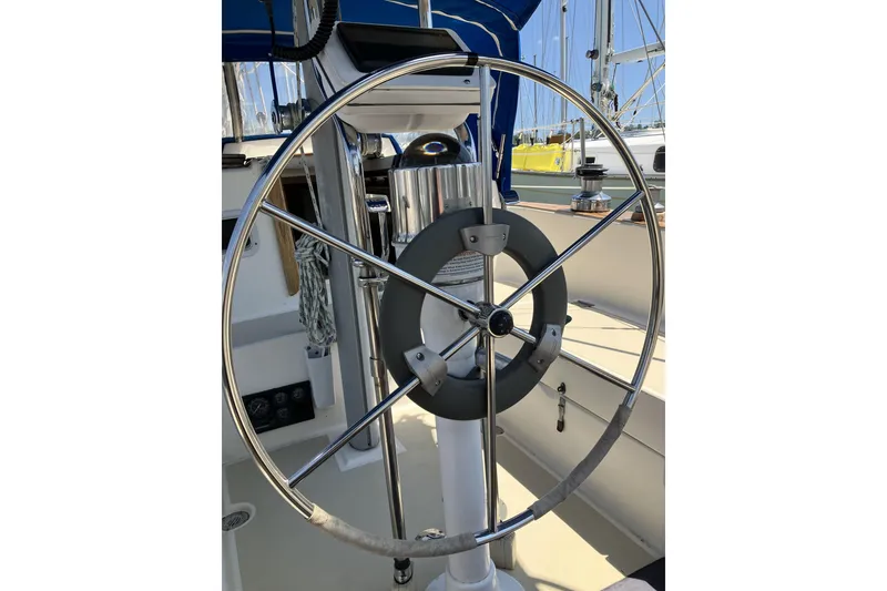 Slide: The Image of Steering wheel of a 1981 Pearson 365 Ketch sailboat, showcasing nautical design. - 9