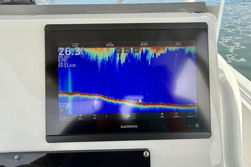 Slide: The Image of Garmin marine display on 2023 Edgewater 245CC boat, showing sonar depth reading. - 19