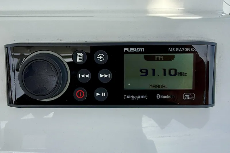 Slide: The Image of Fusion MS-RA70NSX stereo system displaying FM 91.10 MHz, on Edgewater 245CC 2023 boat. - 20