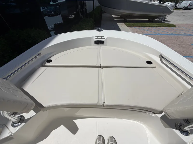 Slide: The Image of The 2027 Boston Whaler 210 Montauk features a spacious bow area with cushioned seating. - 28