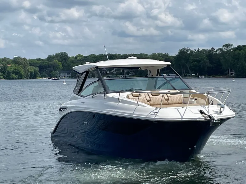 Slide: The Image of Sea Ray Sundancer 320 boat on calm water, 2020 model. - 0