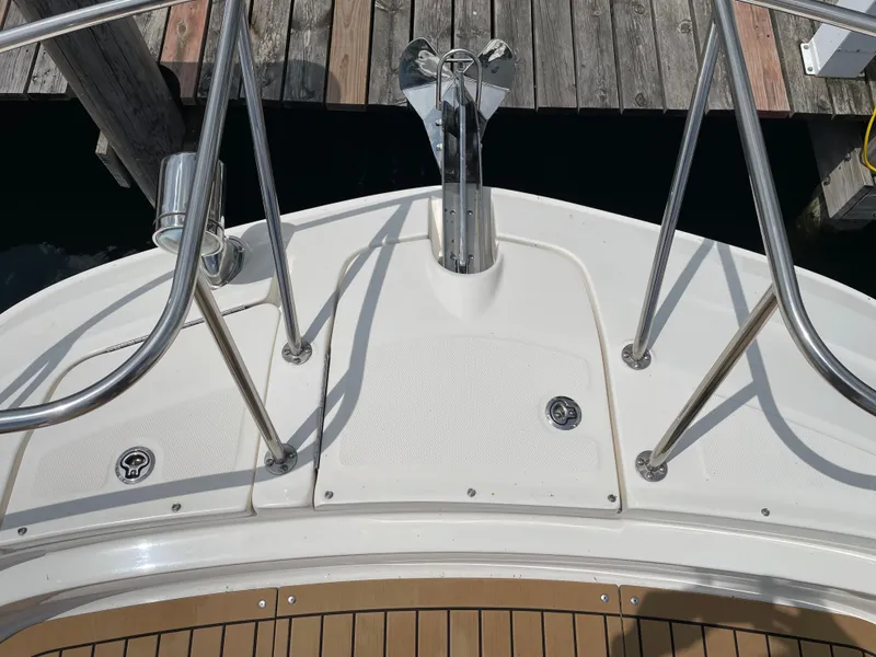 Slide: The Image of Bow of a Sea Ray Sundancer 320 boat at the dock. - 10