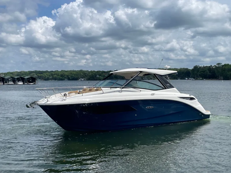 Slide: The Image of Sea Ray Sundancer 320 boat on calm water, 2020 model. - 2