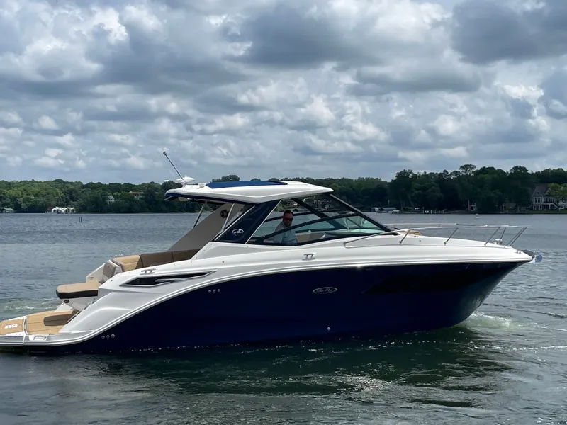 Slide: The Image of Sea Ray Sundancer 320 boat on a calm lake, 2020 model. - 5