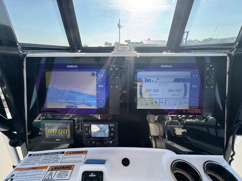 Slide: The Image of NauticStar 2602 Legacy 2022 boat console with Simrad displays. - 19