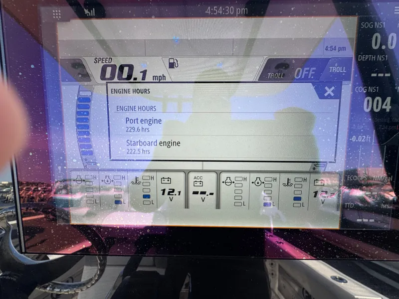 Slide: The Image of NauticStar 2602 Legacy 2022 boat display showing engine hours. - 22
