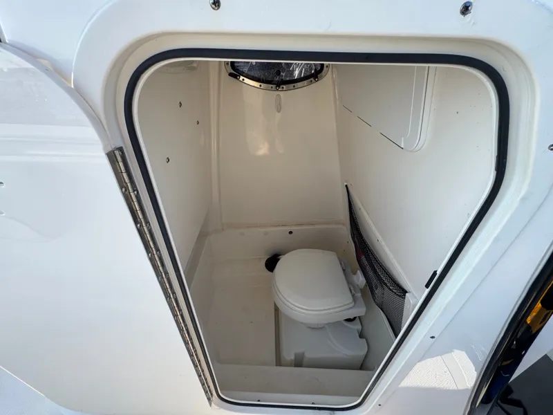Slide: The Image of Interior of 2022 NauticStar 2602 Legacy featuring a toilet. - 24
