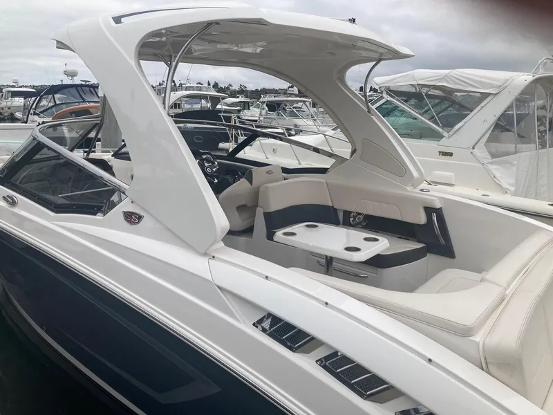 Slide: The Image of 2017 Chaparral 307 SSX boat with luxurious interior at the marina. - 10