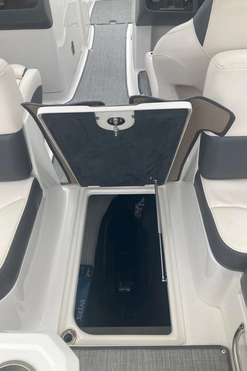 Slide: The Image of Interior of 2017 Chaparral 307 SSX with storage compartment. - 12