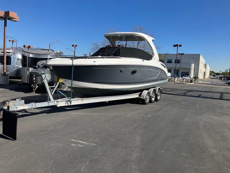 Slide: The Image of 2017 Chaparral 307 SSX boat on trailer outdoors. - 19