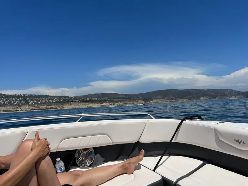 Slide: The Image of Relaxing on a 2017 Chaparral 307 SSX boat with coastal view. - 5