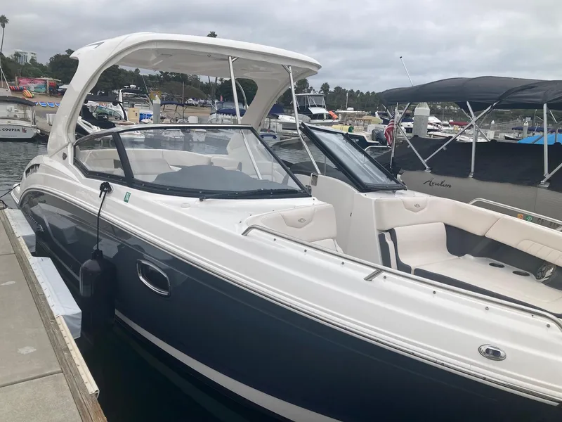 Slide: The Image of 2017 Chaparral 307 SSX boat docked, side view. - 7