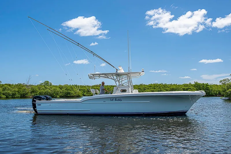 The Image of 2008 Buddy Davis 34 Center Console boat cruising on a sunny day. - 1